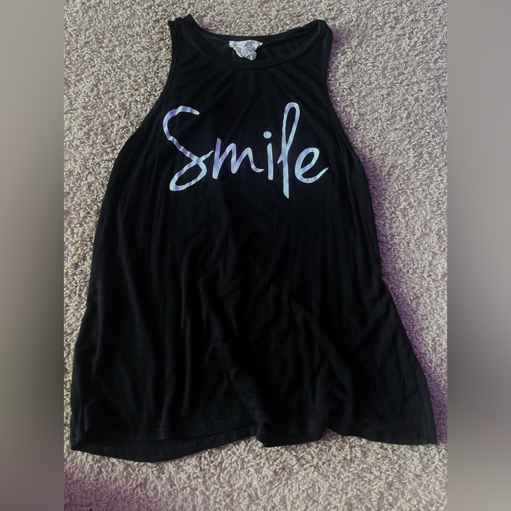 Loose fit. Nice, soft material. Barely worn.